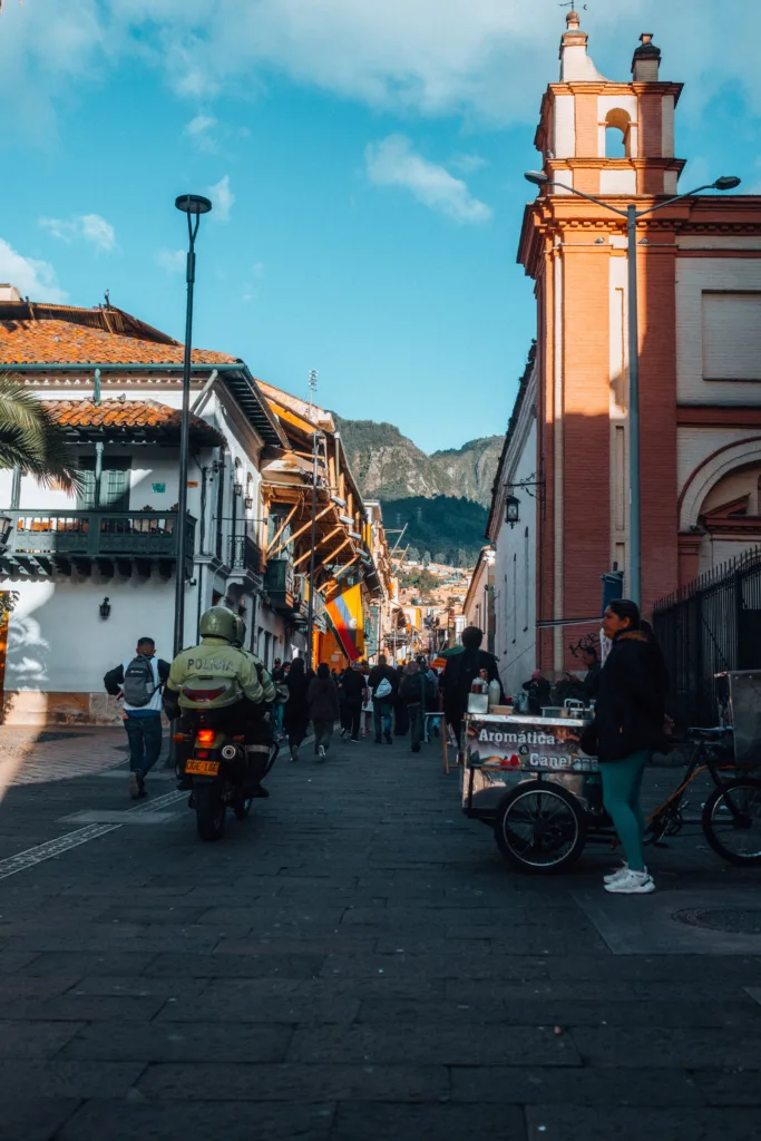 Vibrant urban street life captured in Bogotá, highlighting local culture and architecture. (Pexels)